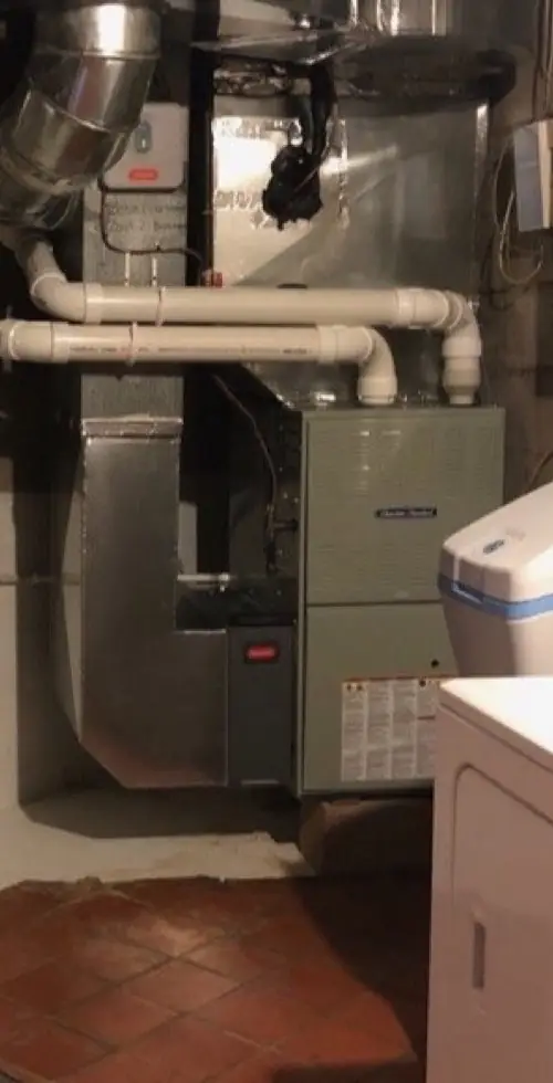 American Standard gas furnace in a basement, with a new sheet metal supply plenum, return drop and PVC intake and exhaust venting